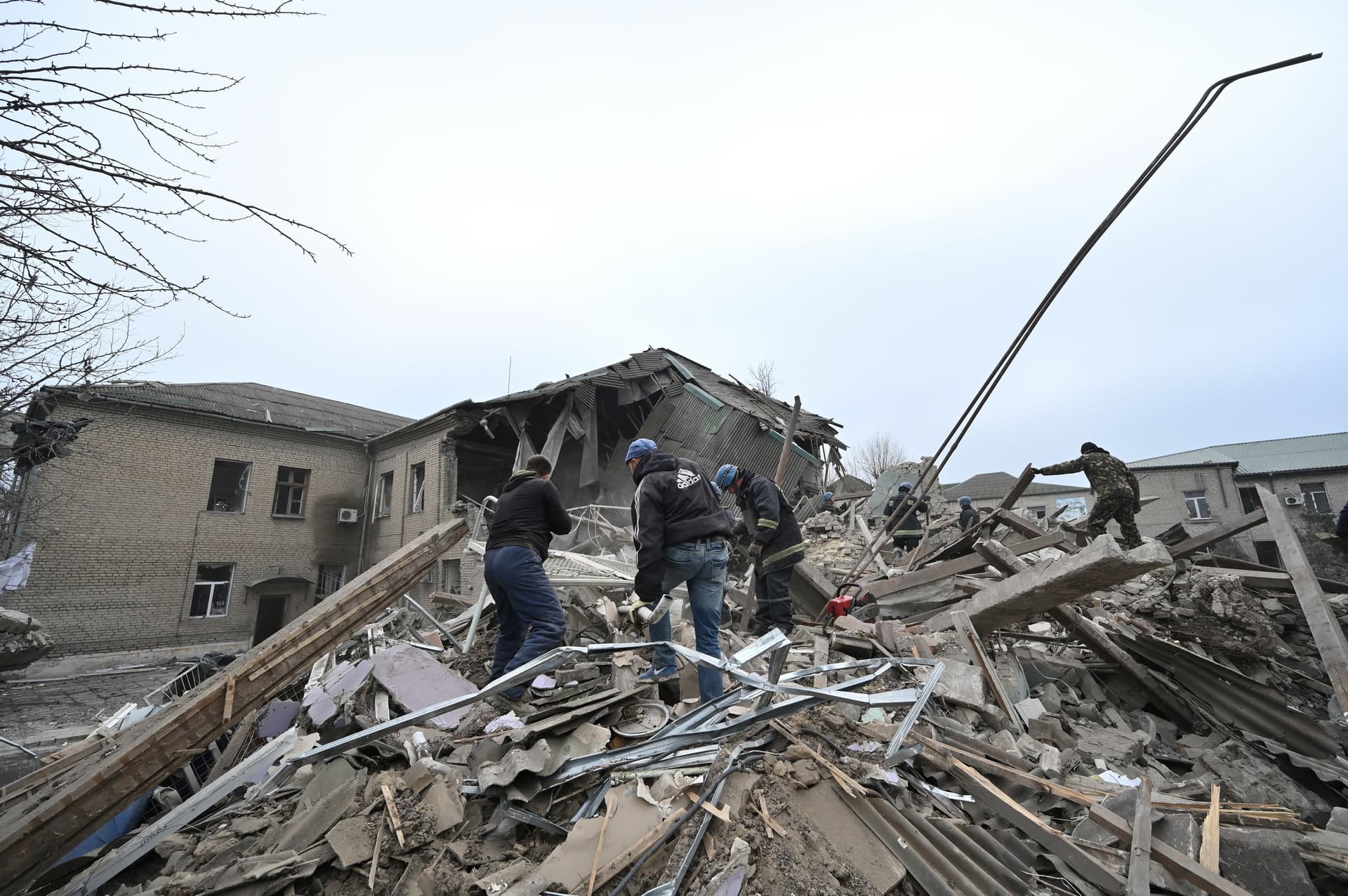 Rescuers work at the site of a maternity ward of a hospital destroyed by a Russian missile attack in Vilniansk