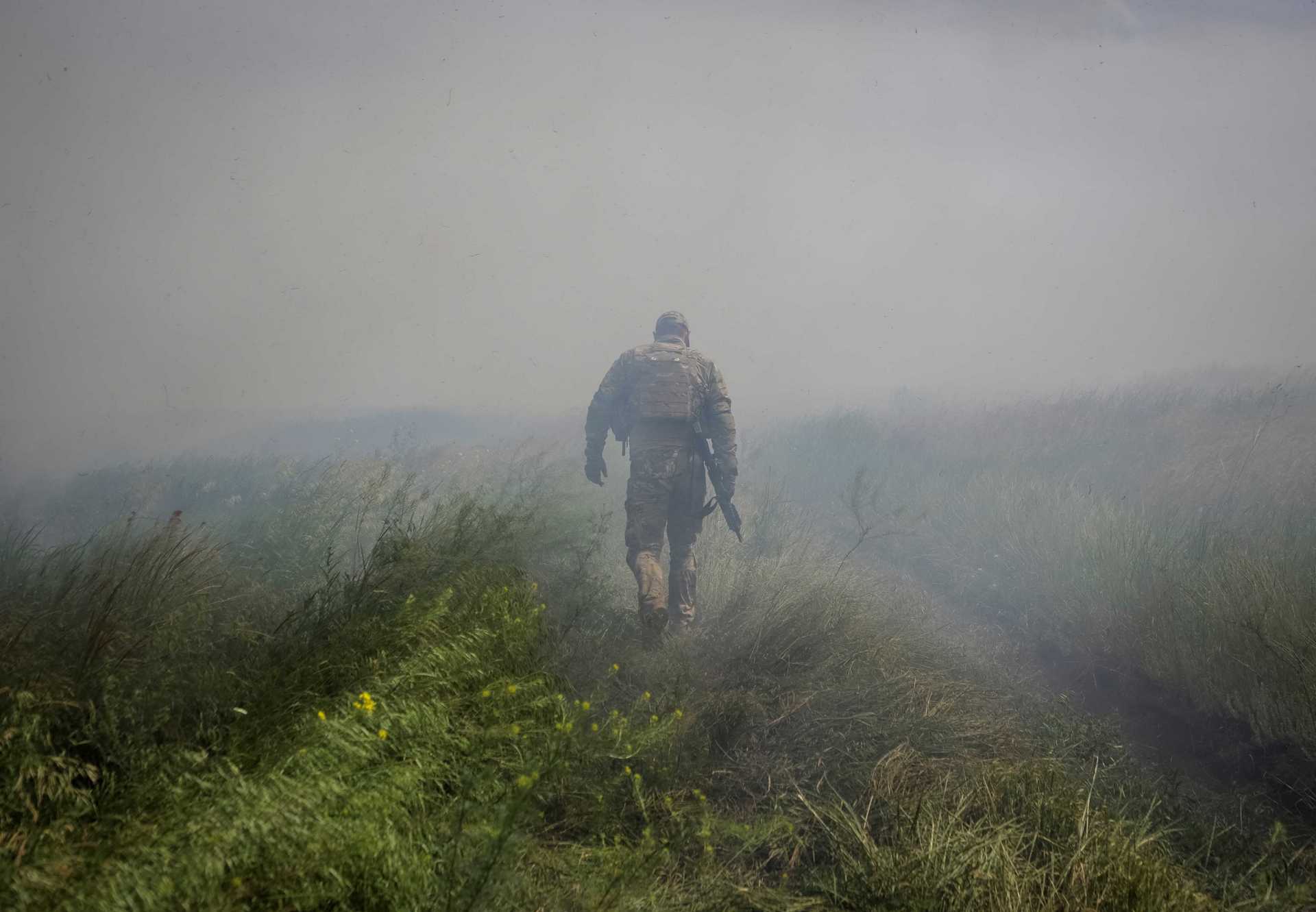 A Ukrainian service member near the newly liberated village Neskuchne