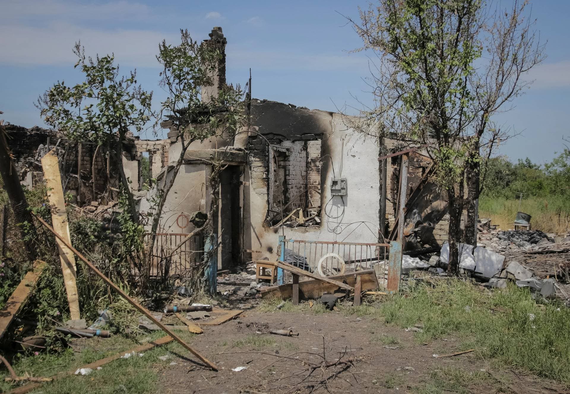 damaged houses in еру village of Neskuchne