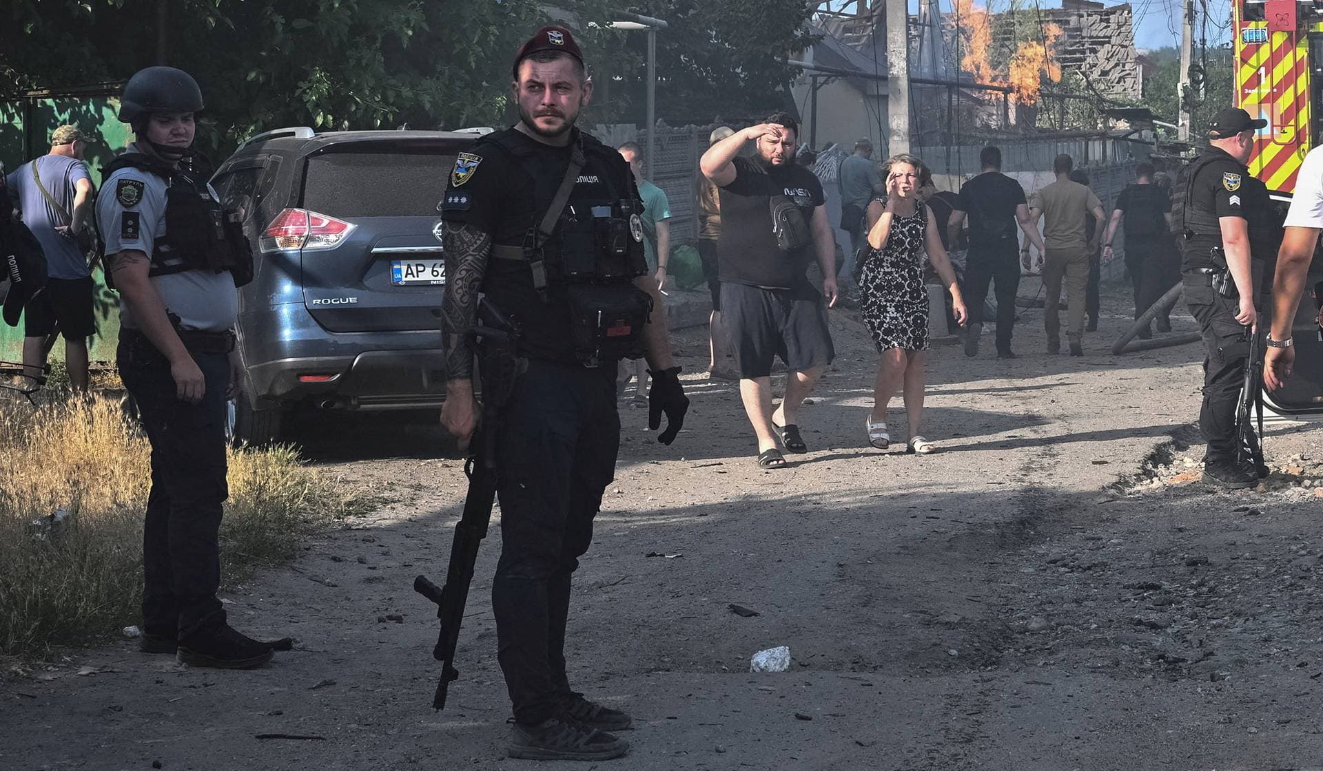 A police officer guards at the site of a Russian air strike in Zaporizhzhia