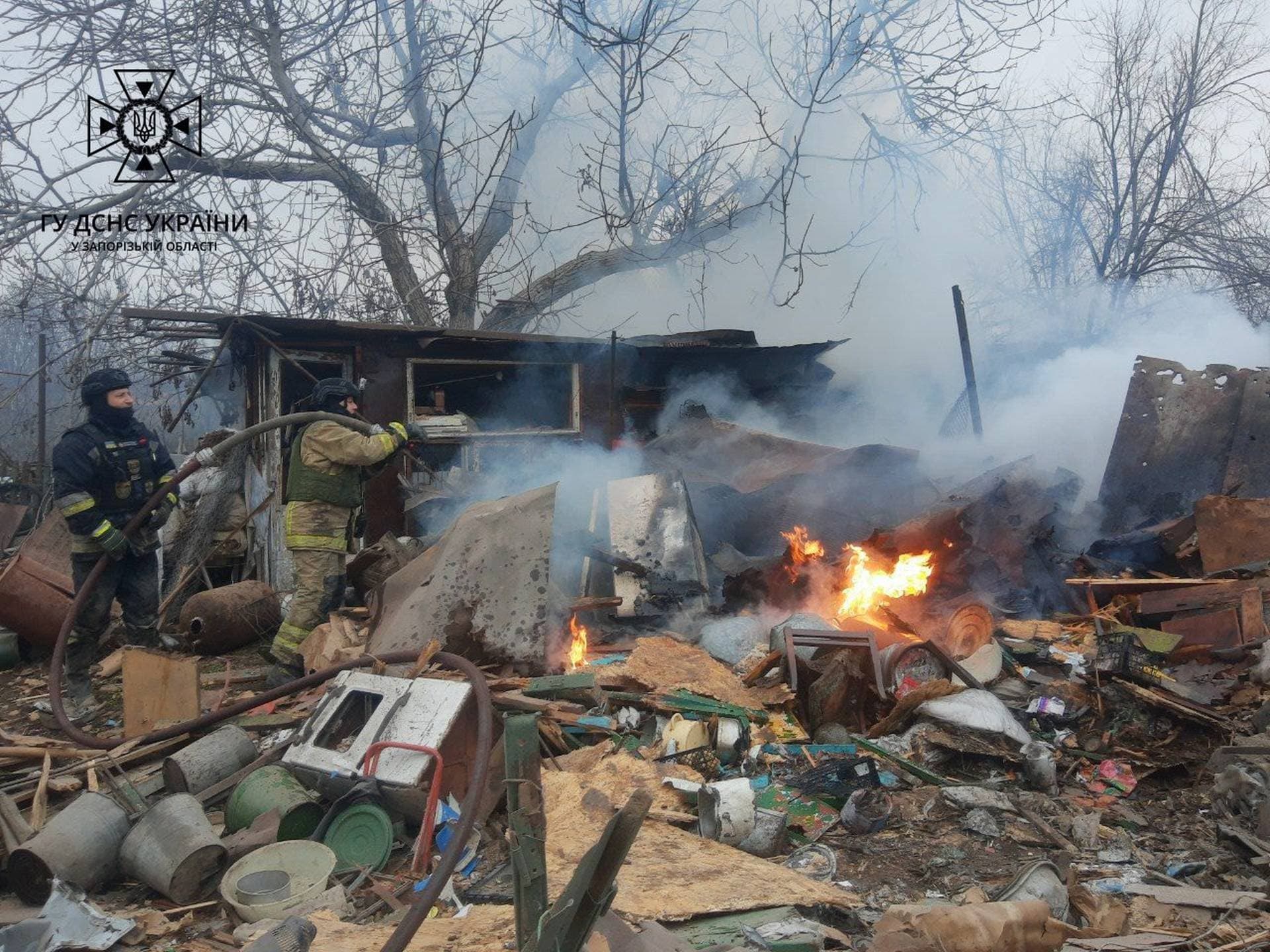 Firefighters at the scene after a Russian drone strike in Zaporizhzhia region