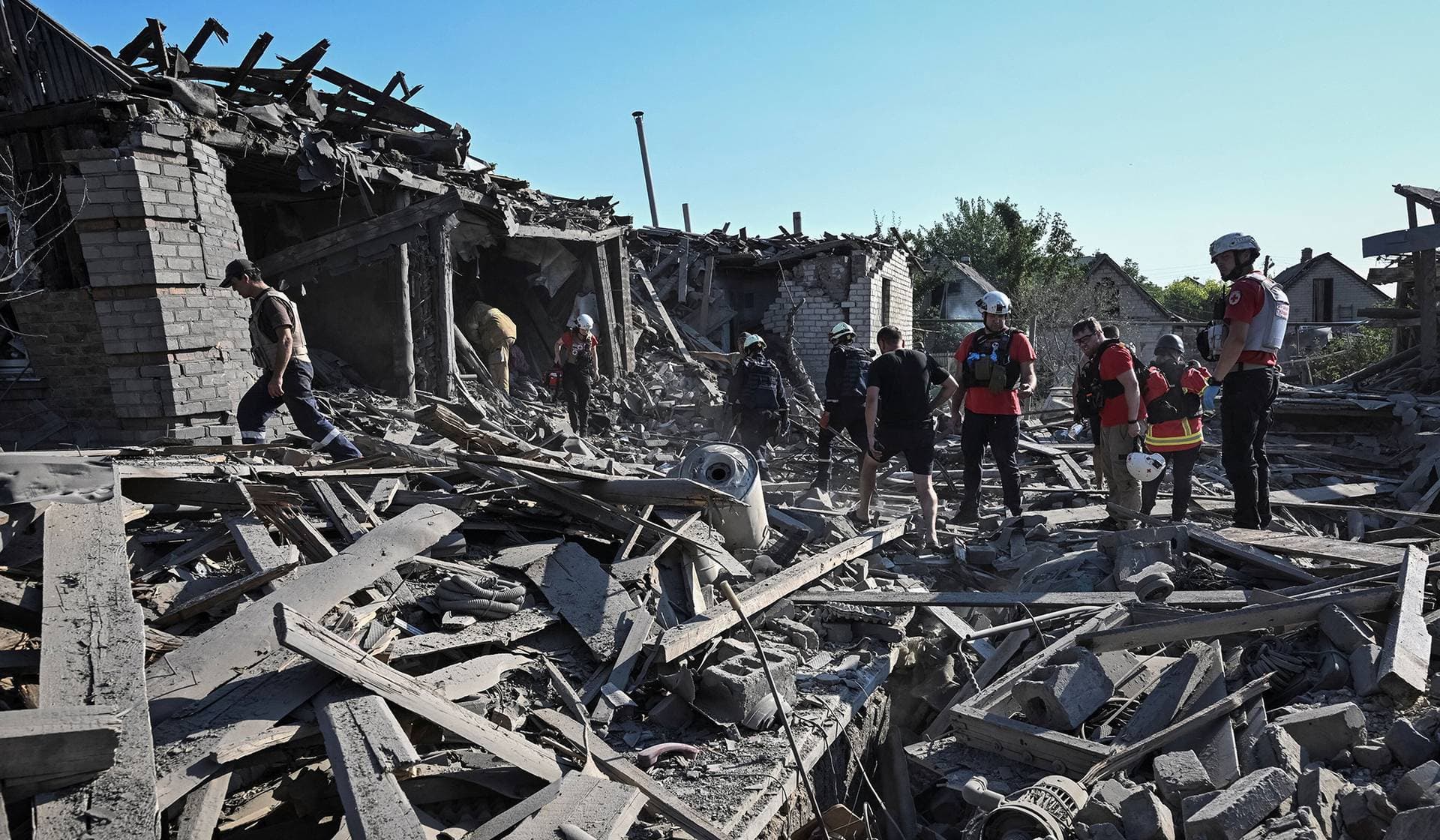 Rescuers work at a site of houses destroyed by a Russian air strike in Zaporizhzhia
