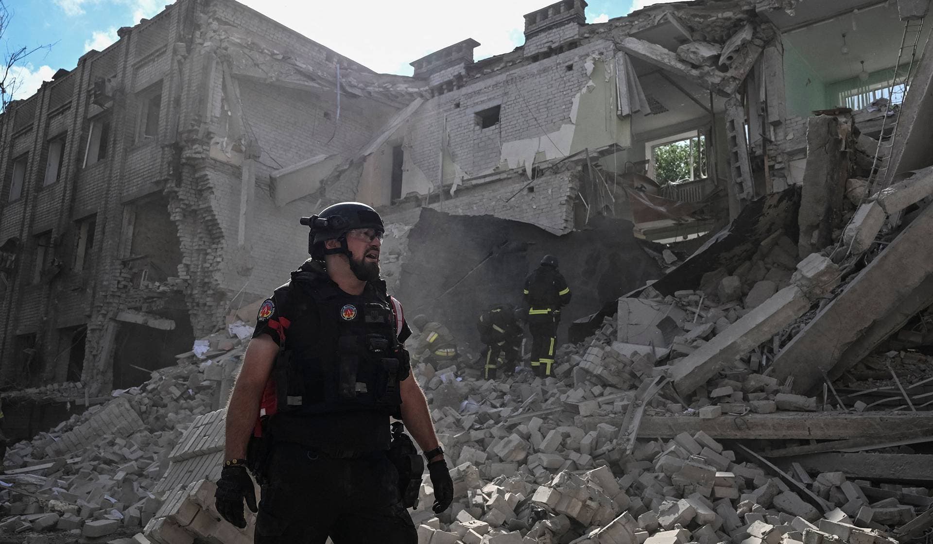 Rescuers and medical workers work at the site of a Russian air strike in Zaporizhzhia