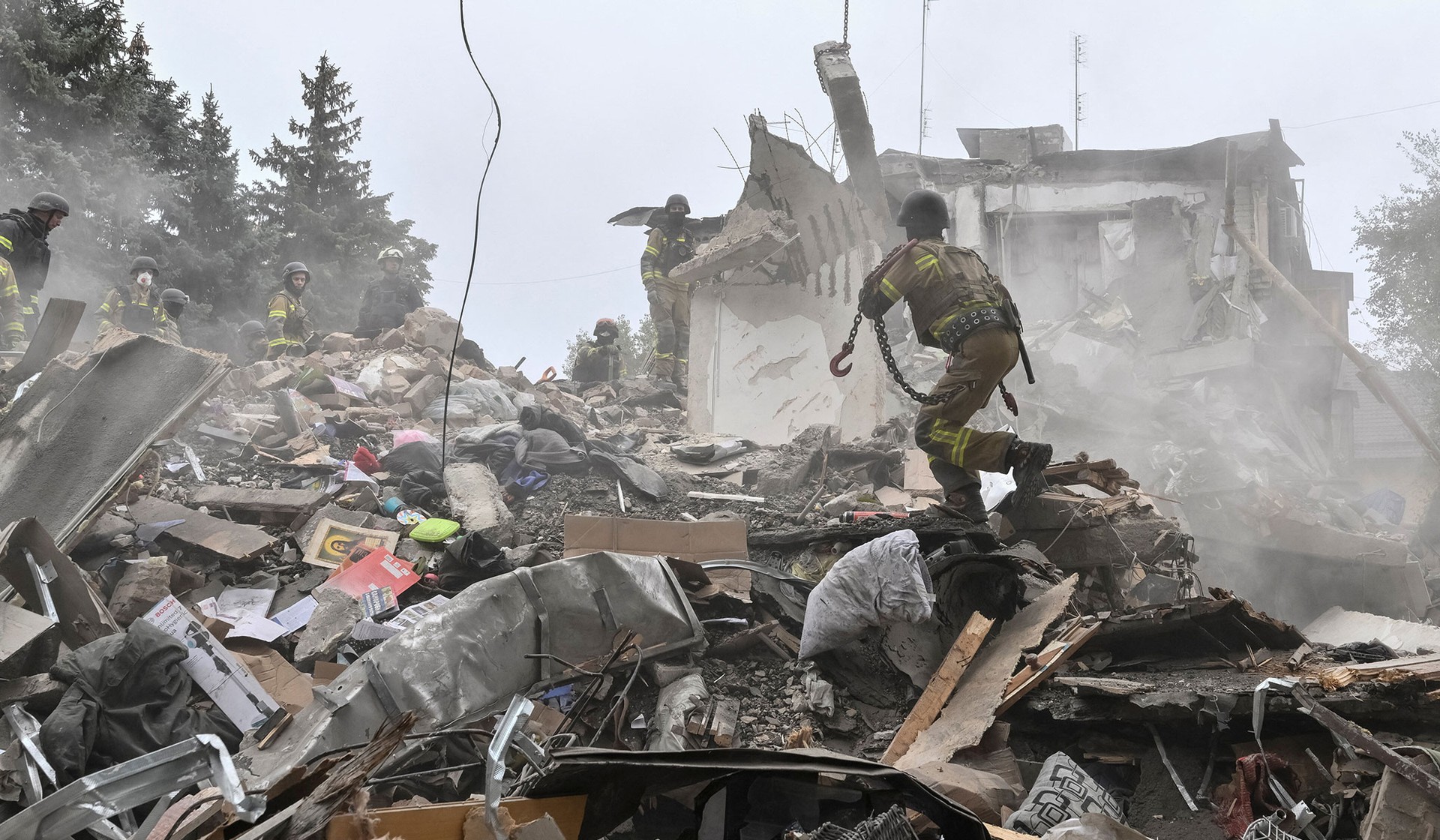 Rescuers work at a site of an apartment building damaged during a Russian air strike in Zaporizhzhia