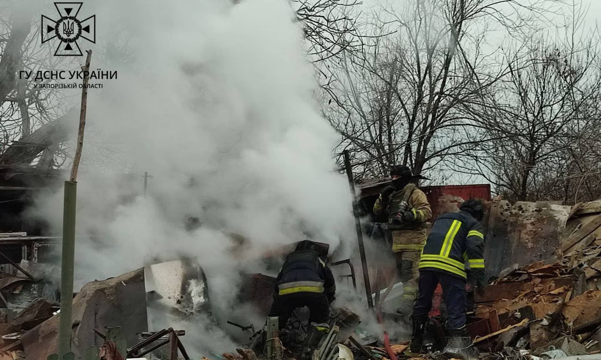 Firefighters at the scene after a Russian drone strike in Zaporizhzhia region