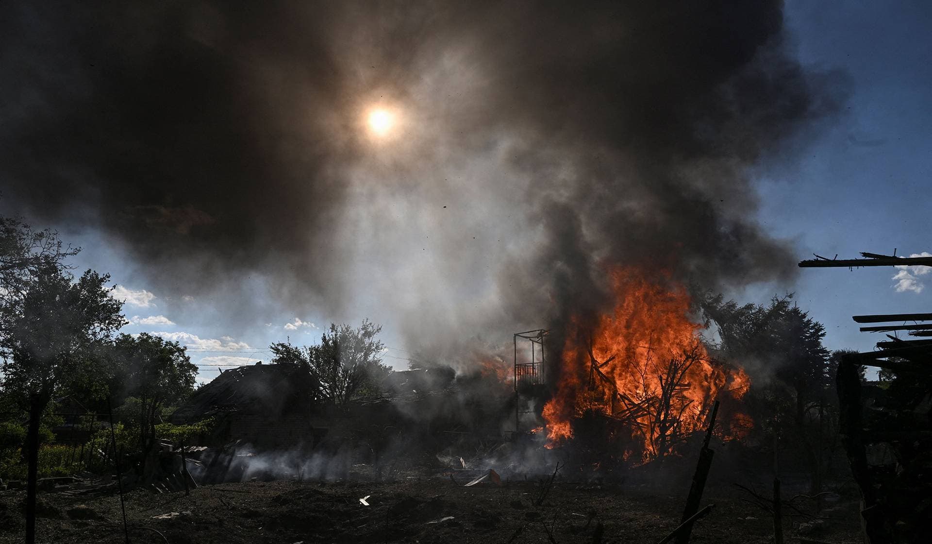 A residential building burns after it was damaged by a Russian air strike in Zaporizhzhia