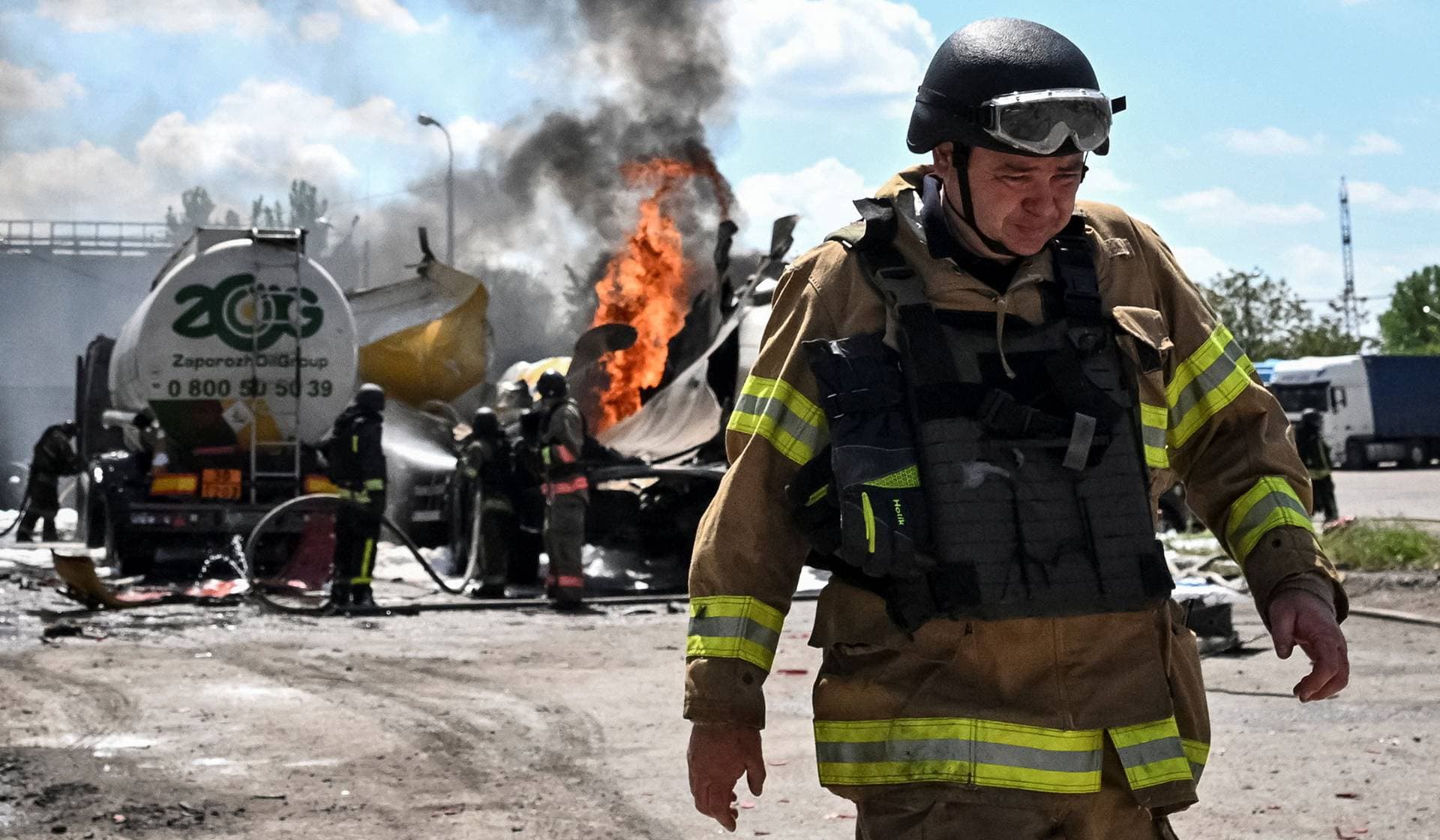 Firefighters work at a site of a Russian drone strike in Zaporizhzhia