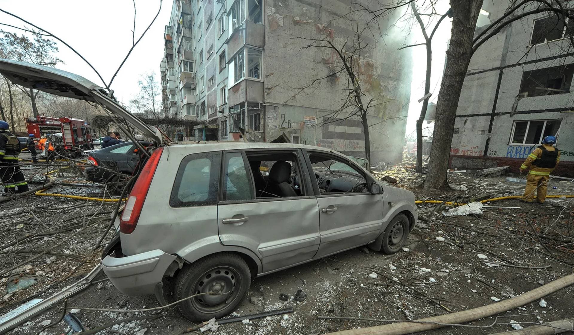 A damaged car next to a residential building hit by a Russian missile strike in Zaporizhzhia