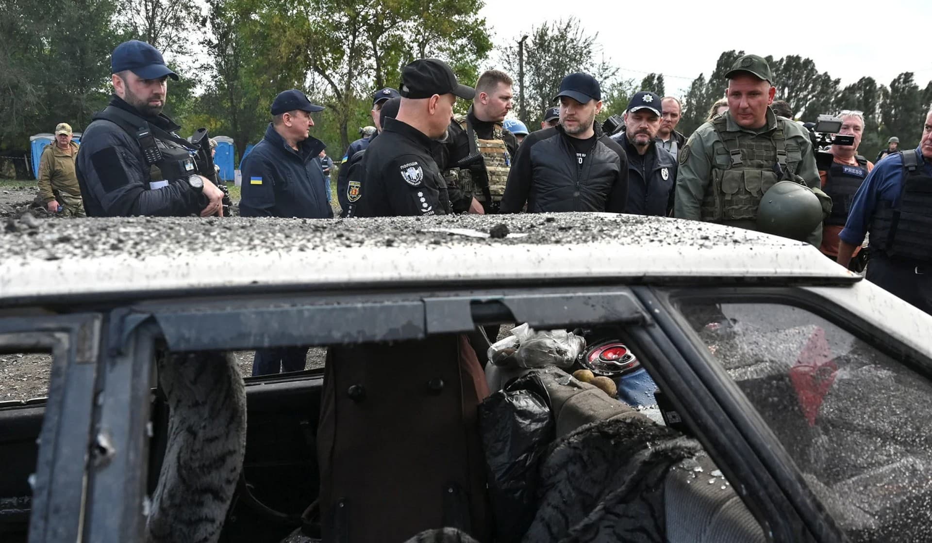 Ukrainian Interior Minister Denys Monastyrskyi visits the site of a Russian missile strike that hit a convoy of civilian vehicles in Zaporizhzhia