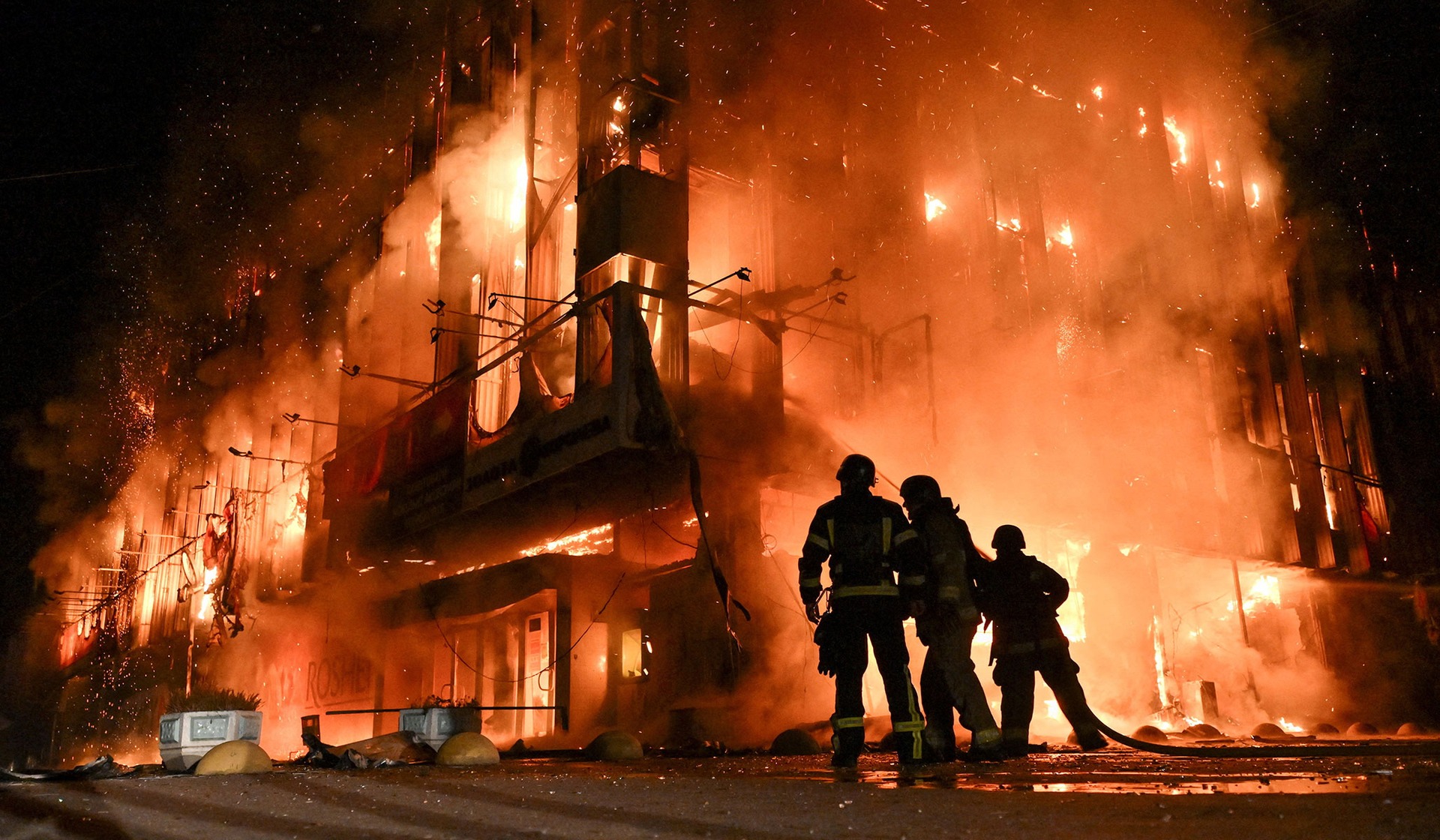 Firefighters work at the site of a shopping mall hit by an overnight Russian drone strike in Zaporizhzhia, Ukraine September 21, 2026.
