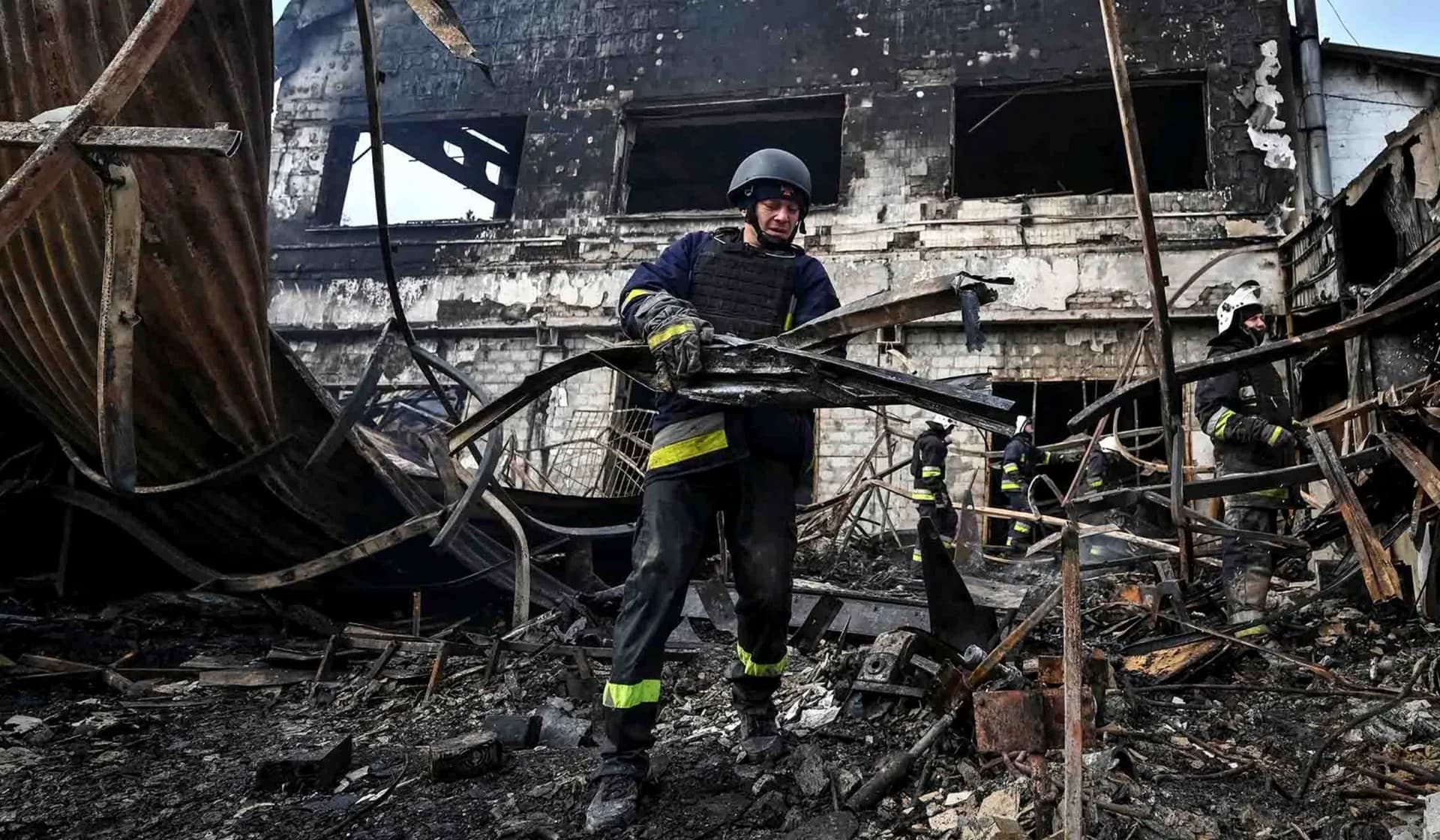 Rescuers work at the site of a Russian military strike in Zaporizhzhia