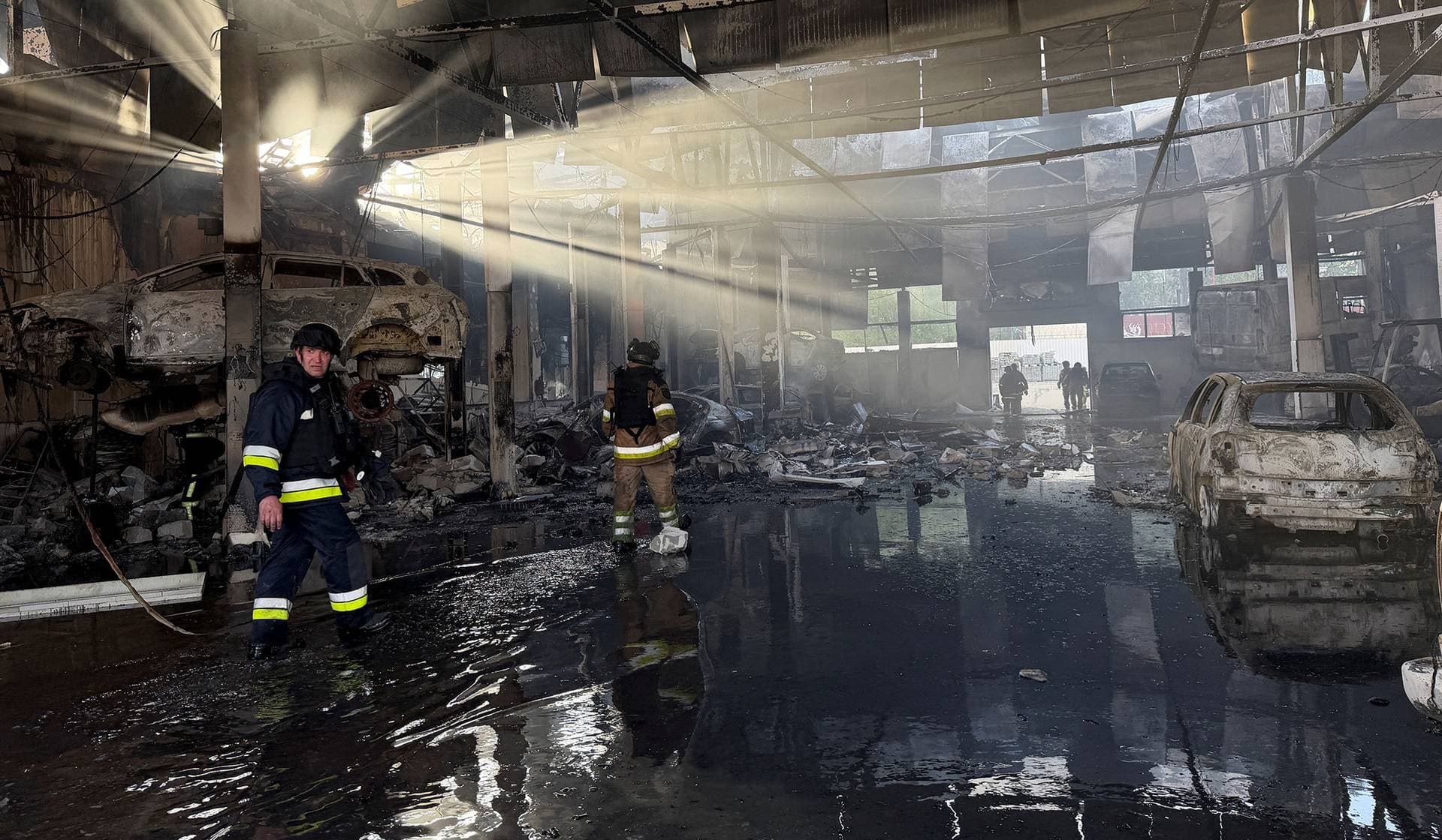 Rescuers work at a site of a Russian air strike in Zaporizhzhia