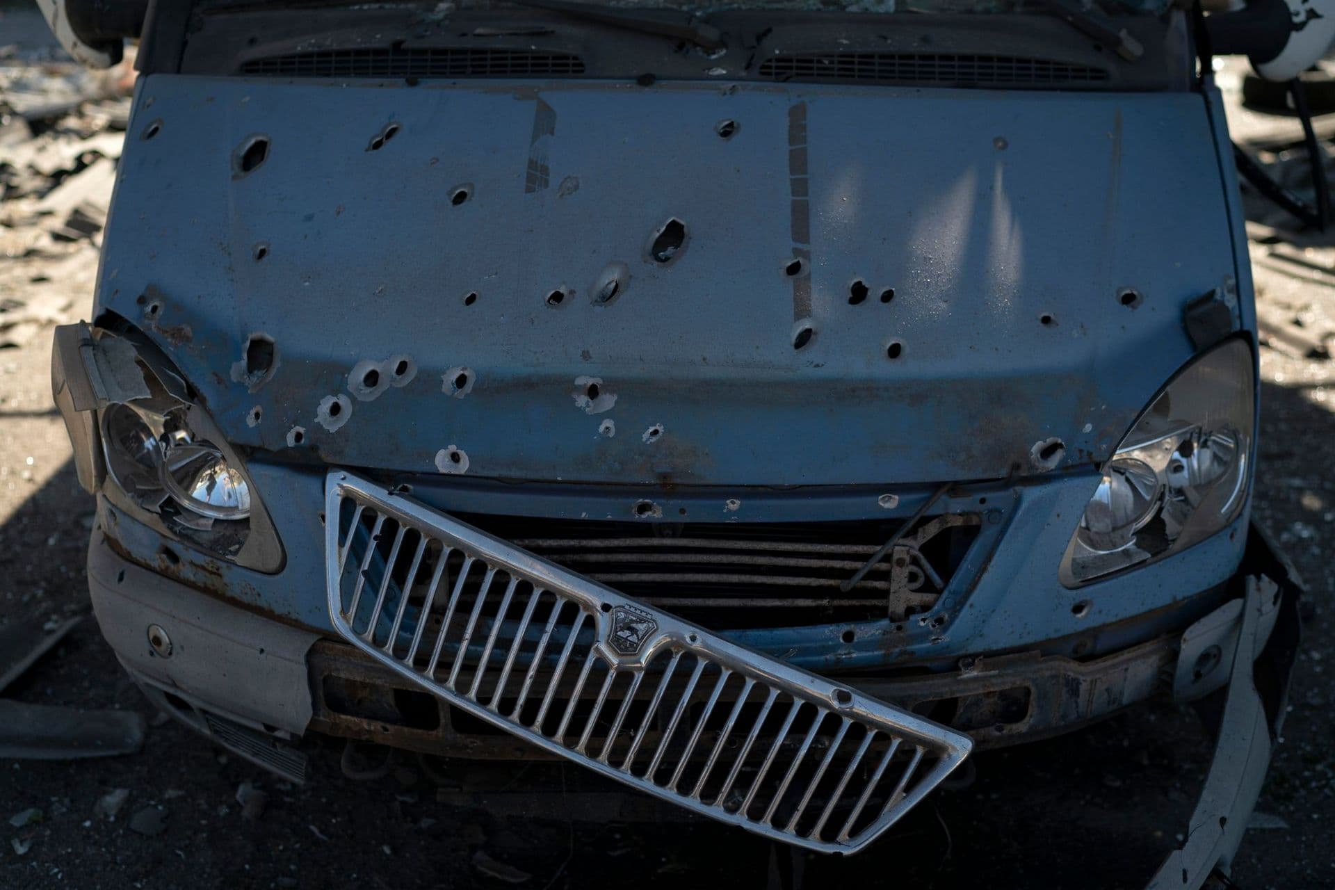 A car damaged from shrapnel is seen at a parking lot after a Russian attack in Zaporizhzhia
