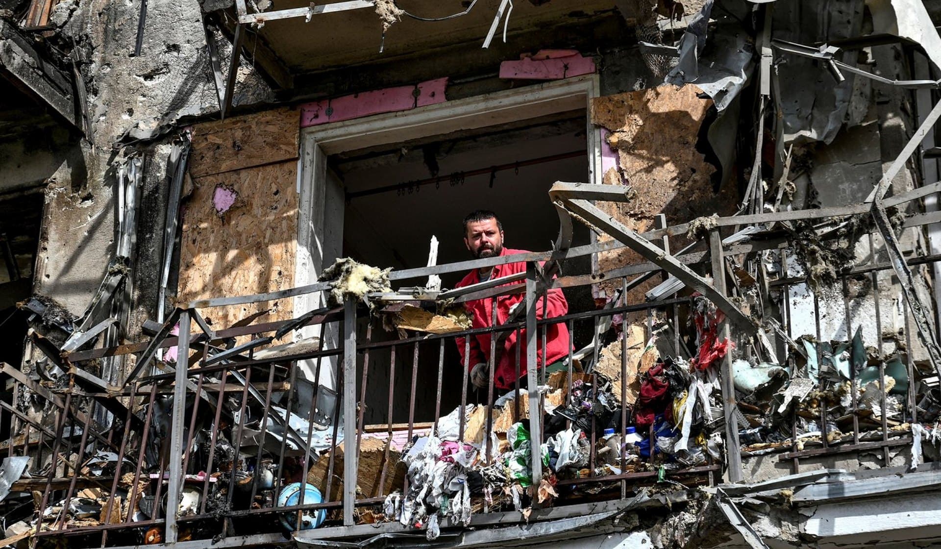 A rescuer works at a site of a residential building damaged by a Russian missile strike in Zaporizhzhia