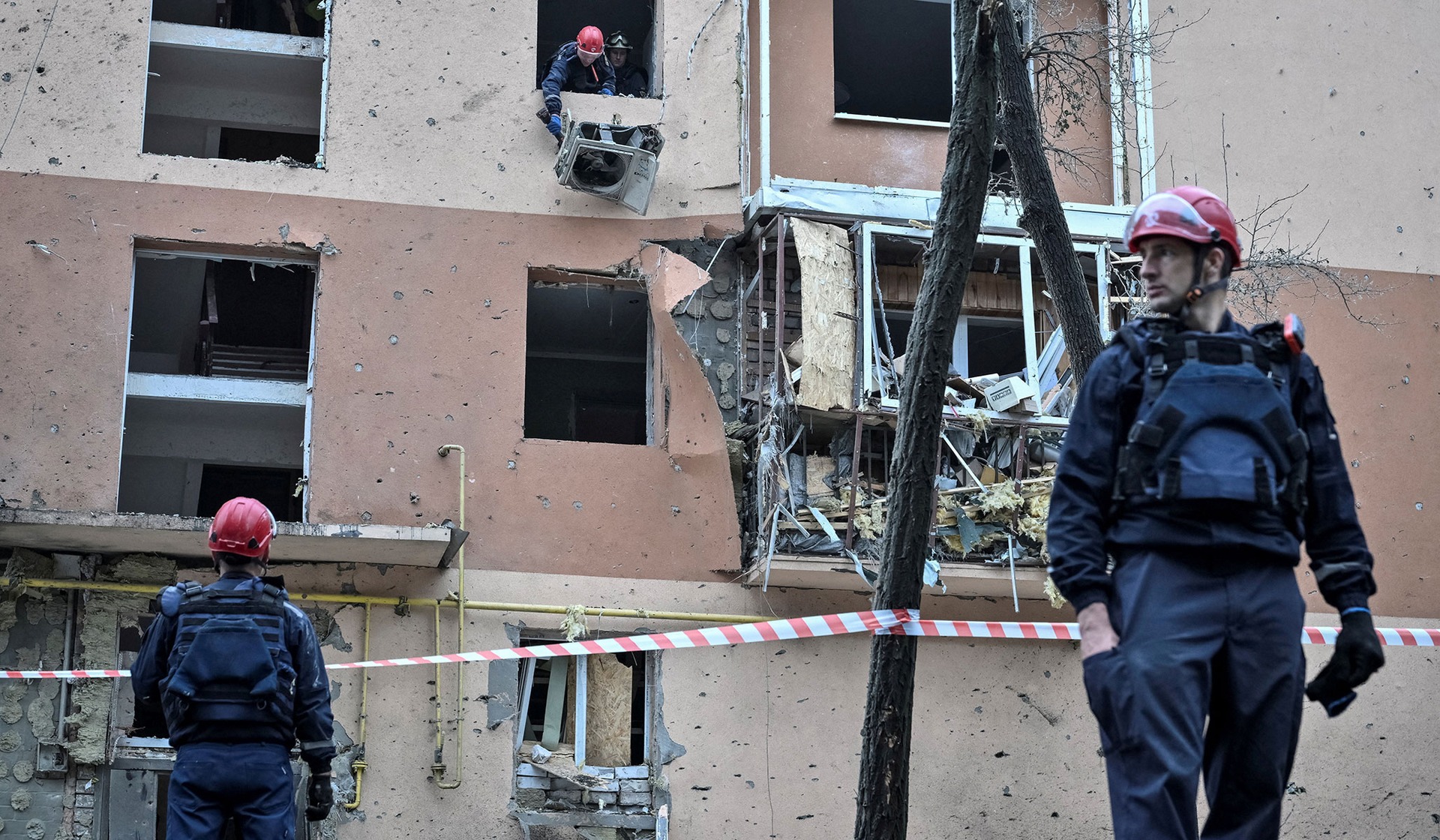 Rescuers work at the site an apartment building damaged during a Russian air strike in Zaporizhzhia