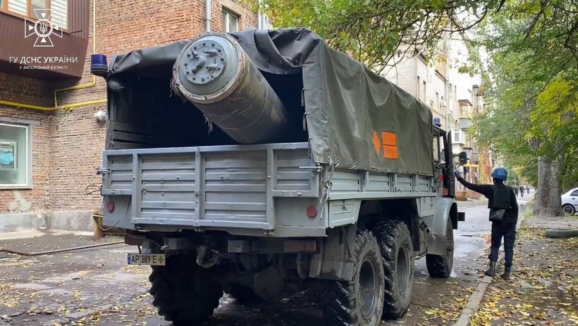 Remains of a Russian missile in a vehicle of the Ministry of Emergency Situations near an apartment building damaged by a Russian missile strike in Zaporizhzhia